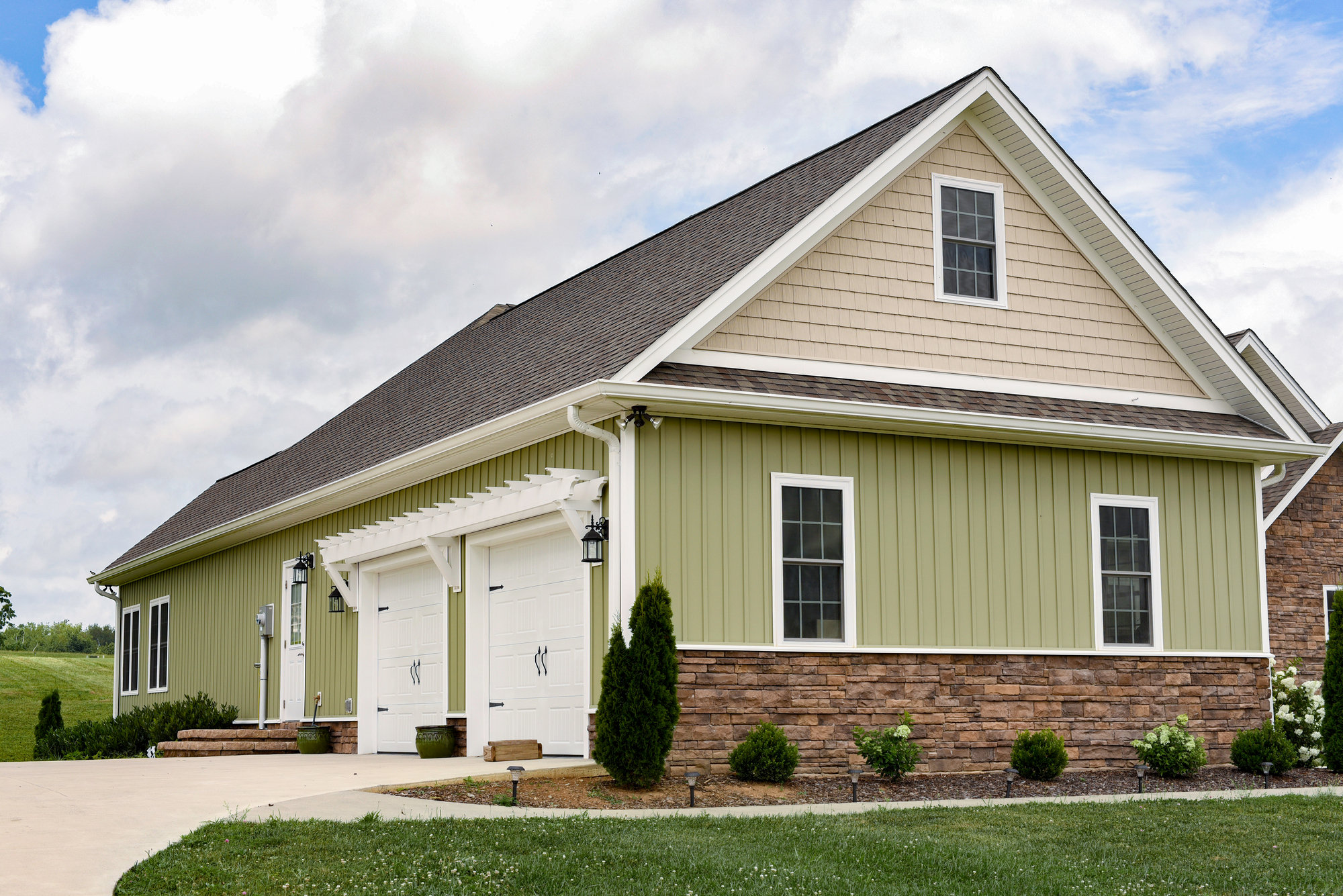 cozy modern home with green siding